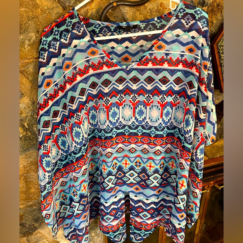 Aztec inspired pattern with a tie knot front. This flowy chiffon gem is cute.